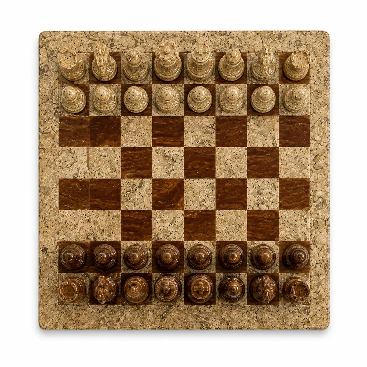A square stone and wood chessboard with carved chess pieces, photographed from directly above on a white background.