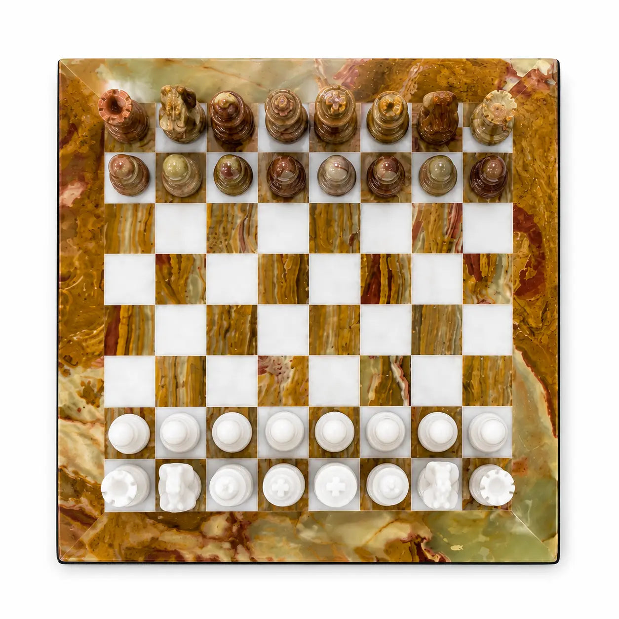 A square marble chessboard with white and brown checkered squares, surrounded by a decorative gold and brown marble border. The chess pieces are arranged at the top and bottom in white and brown tones, photographed from directly above on a white background.