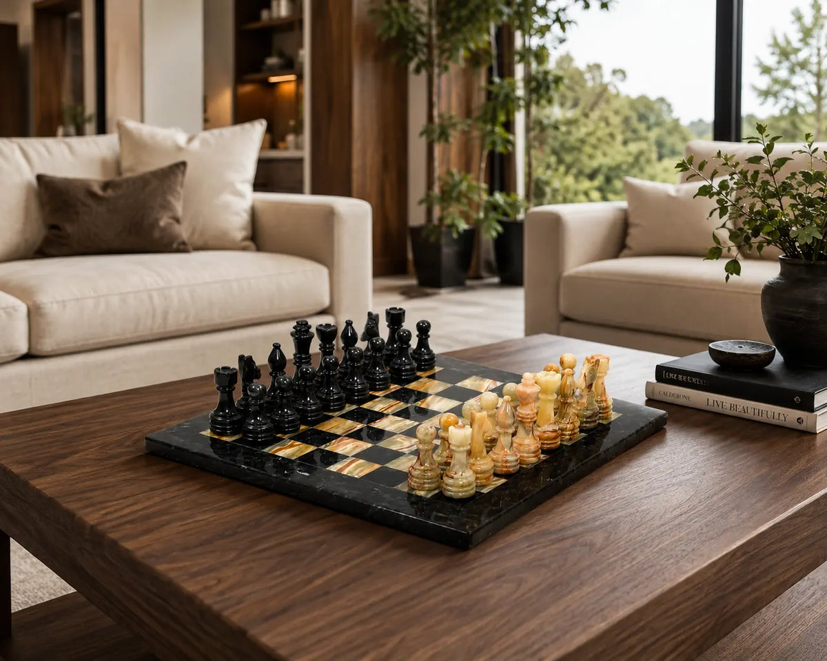 A black and gold checkers game set arranged on a dark wood coffee table in a modern living room with beige sofas and potted plants.