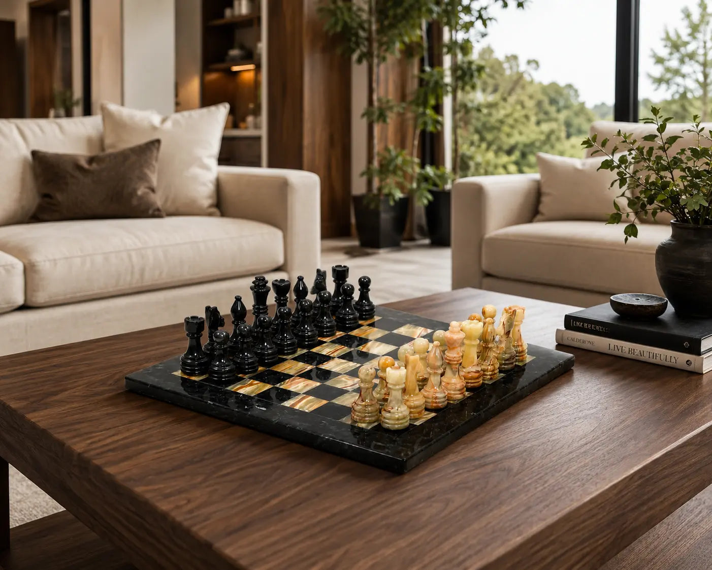 A black and gold checkers game set arranged on a dark wood coffee table in a modern living room with beige sofas and potted plants.