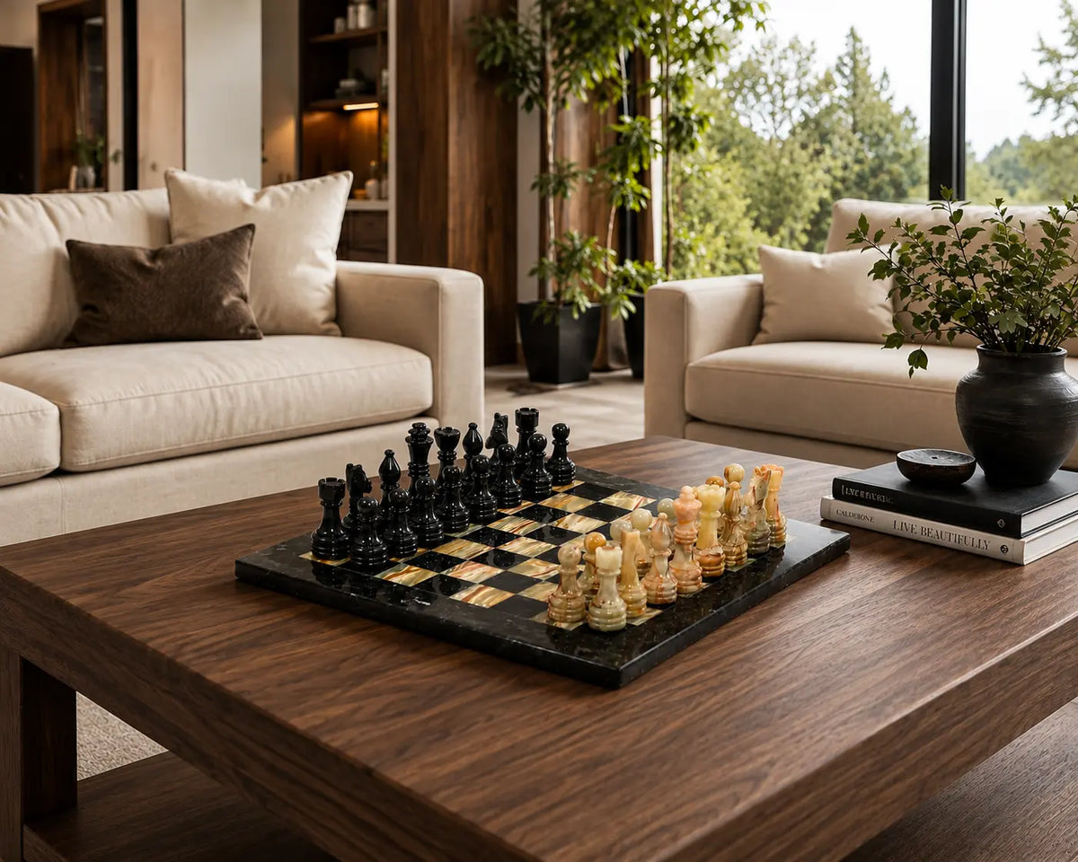 A black and beige checkers game set on a dark wood coffee table in a modern, sunlit living room with cream sofas and large windows.