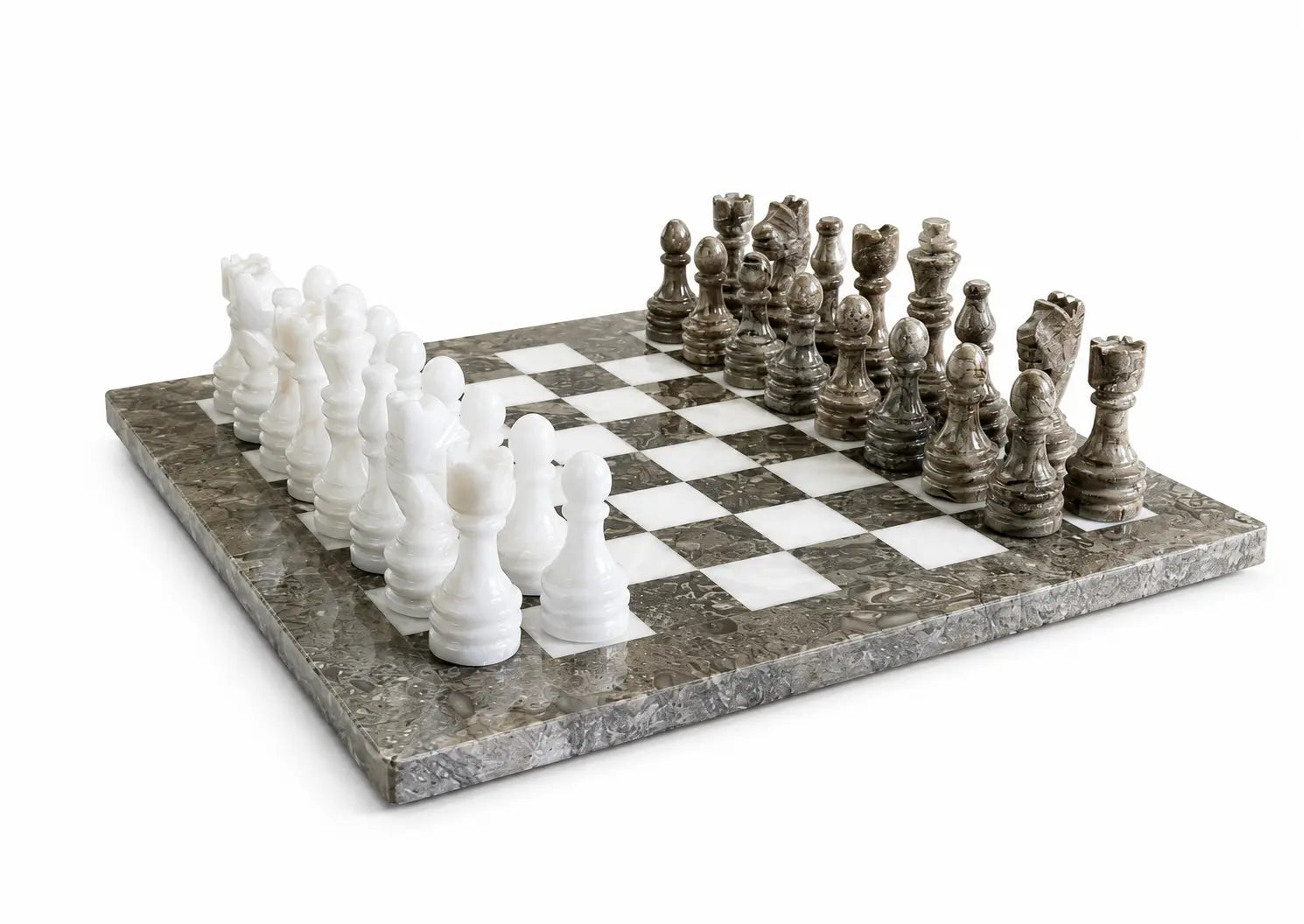 A marble chess set on a white background, featuring a gray and white marble checkered board with white and dark gray stone chess pieces.