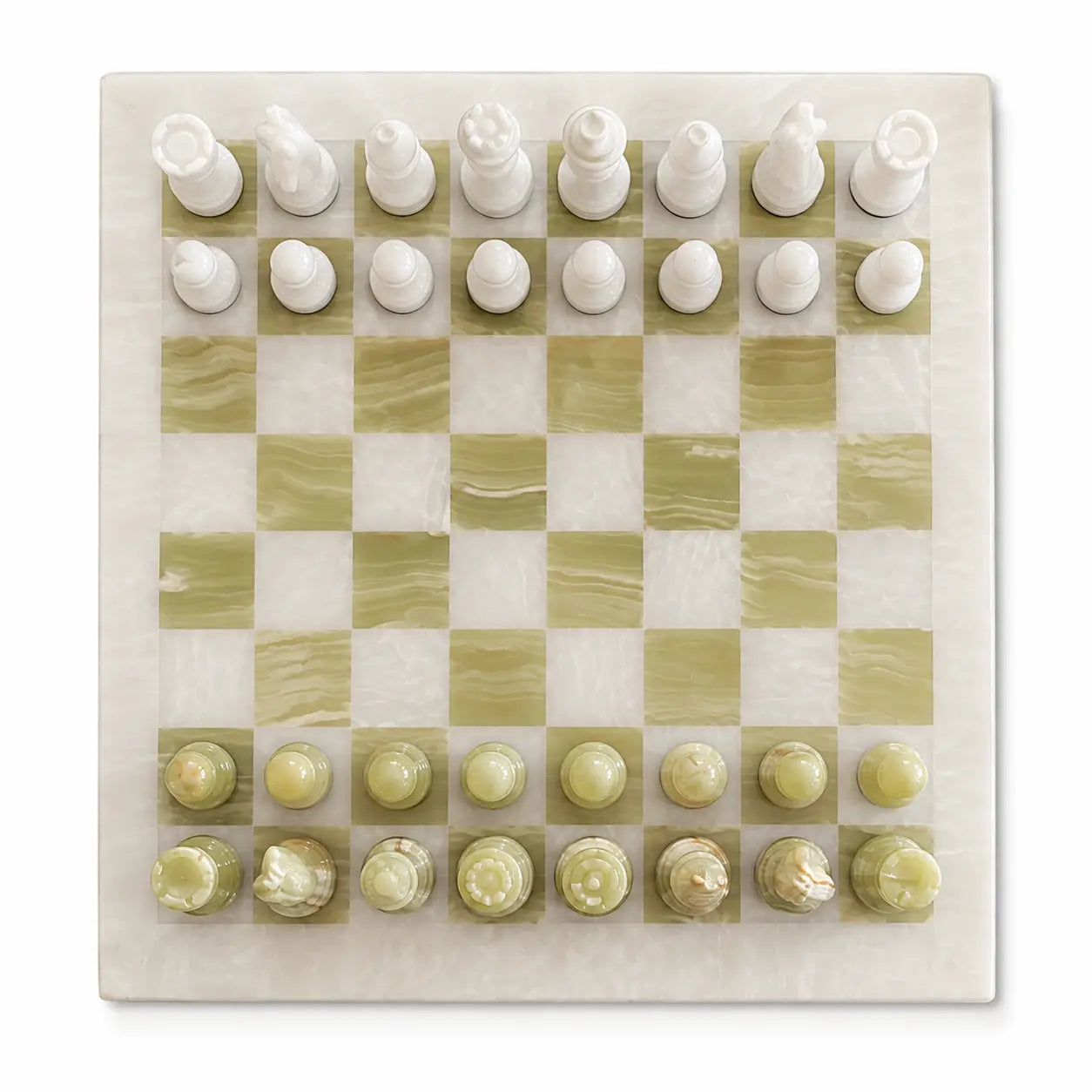 An elegant marble chess set featuring a square board with alternating sage green and cream marbled squares, complete with white and pale green chess pieces arranged in starting positions.