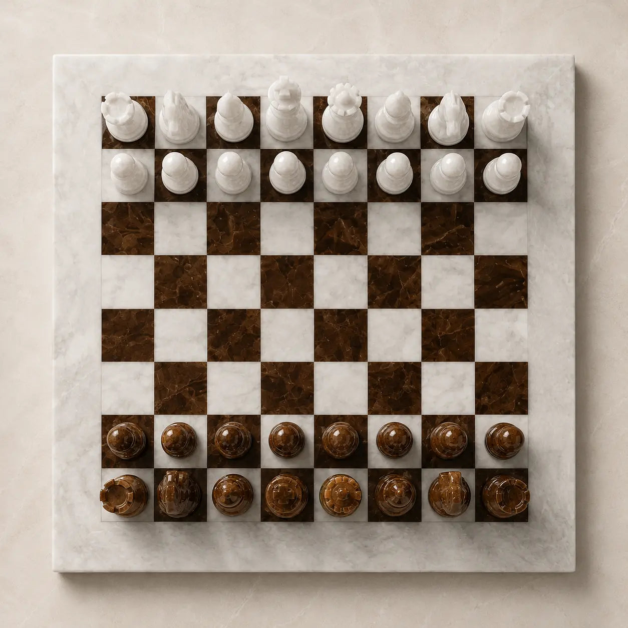 A square marble chessboard with white and brown checkered squares, topped with white and brown stone chess pieces, photographed from directly above on a light beige background.